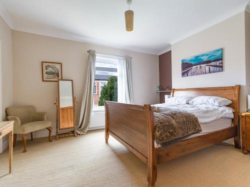 a bedroom with a bed and a window at Cosy 2 bedroom house in the heart of Morpeth in Morpeth