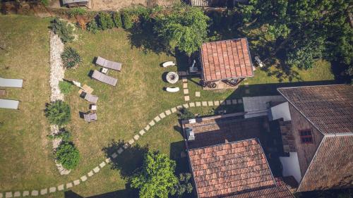 an overhead view of a yard with a gravel road at Padláskincsek Vendégház in Nagybörzsöny