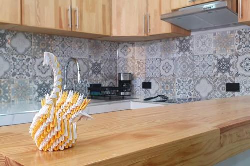 a kitchen counter with a bunch of corn sculptures on it at La Soley, One-Bedroom Apartment in Oaxaca City