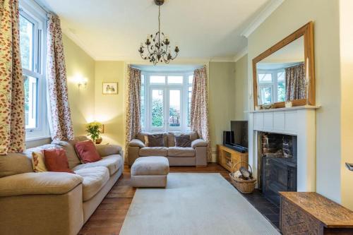 a living room with a couch and a fireplace at Character property perfect for families in Ryde