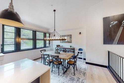 a kitchen and dining room with a table and chairs at Beaver Creeks Meadows in Beaver Creek