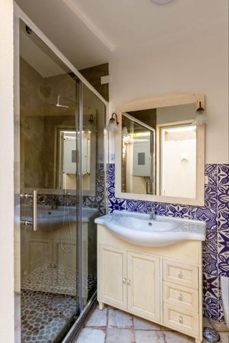 a bathroom with a sink and a shower at Casa Mimina in Ischia