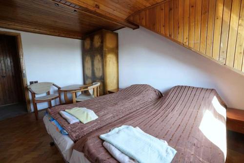 a bedroom with a bed with two towels on it at Hostel na Anhellego in Szczecin