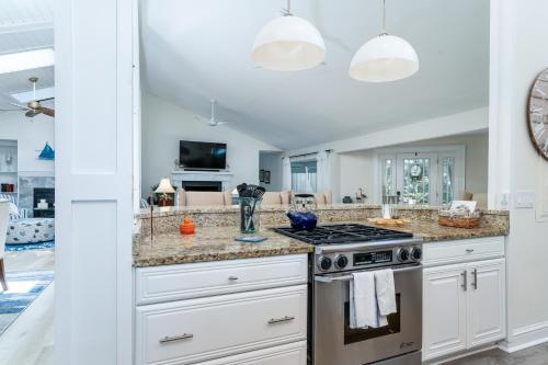 a kitchen with white cabinets and a stove at 2932 Captain Sams in Johns Island
