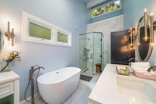 a bathroom with a white tub and a shower at 2932 Captain Sams in Johns Island