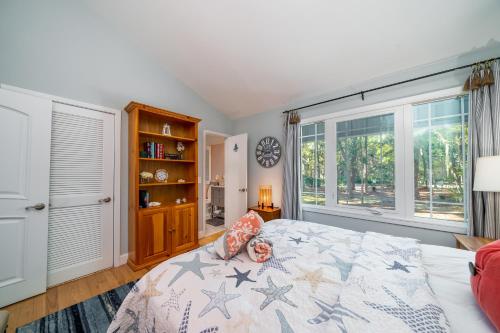 a bedroom with a bed and a large window at 2932 Captain Sams in Johns Island