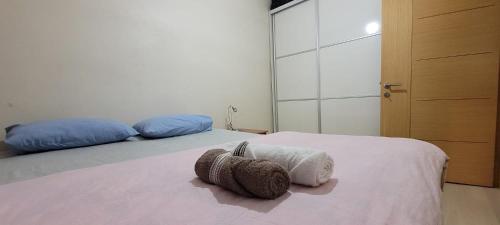 a bedroom with two beds with towels on it at An Easy Transport and Quiet Apartment in Istanbul in Istanbul