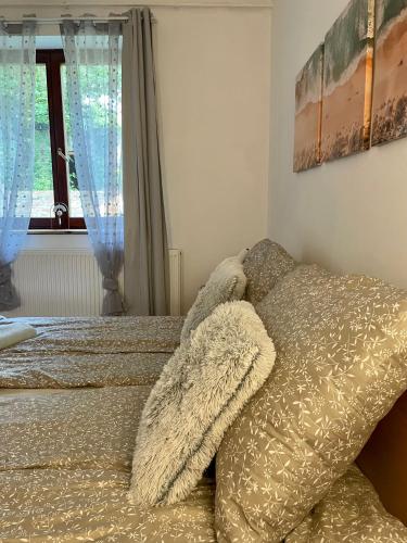 Cama o camas de una habitación en BONI Apartman