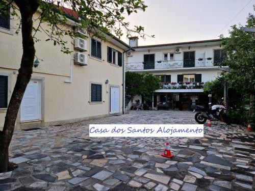 a scooter parked in front of a building at Casa Dos Santos Alojamento - Guest House in Geres