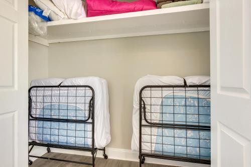 two baskets in a laundry room with towels at Waterfront Alabama Vacation Rental with Deck in Coden