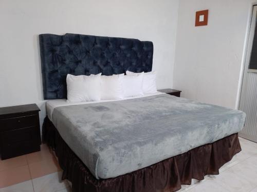 Postel nebo postele na pokoji v ubytování Hotel Villa Bonita Express