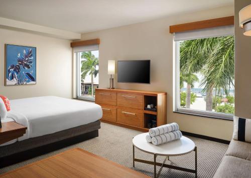 a hotel room with a bed and a television at Faro Blanco Resort & Yacht Club in Marathon