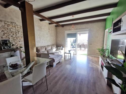 a living room with a couch and a table at Apartamento vistas mar amplio in Santa Cruz de Tenerife