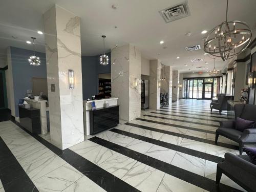 a lobby with black and white marble floors and chandeliers at Holiday Inn Express - Dallas Downtown by IHG in Dallas