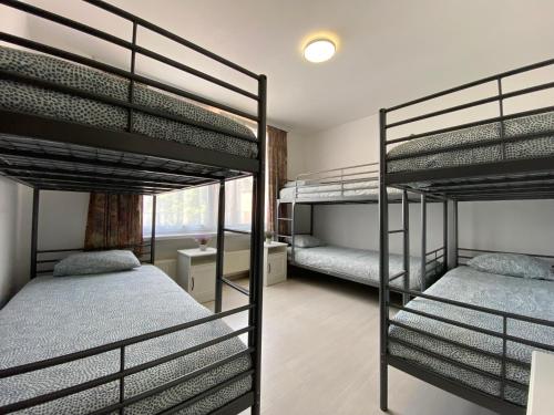 two bunk beds in a room with a bedroom at Apartments Bex. in Antwerp
