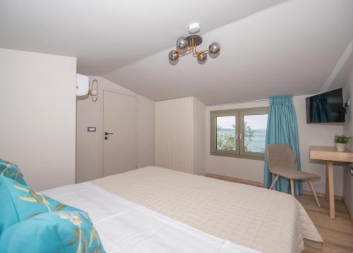 Ένα ή περισσότερα κρεβάτια σε δωμάτιο στο Casa Spiaggia