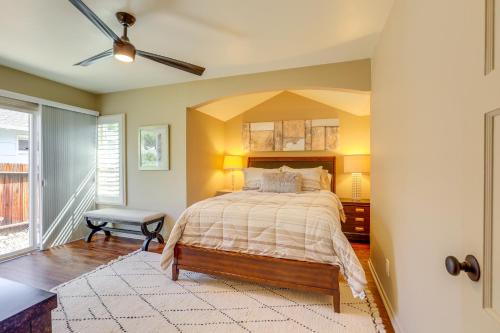 a bedroom with a bed and a ceiling fan at Modern Reno Abode Near Parks and Midtown! in Reno