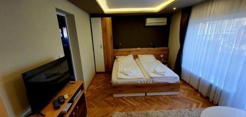 Ivet Guest rooms tesisinde bir odada yatak veya yataklar