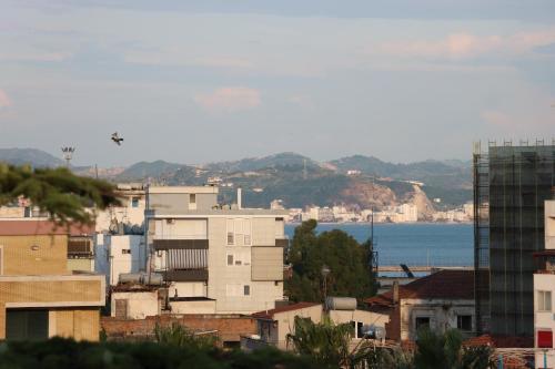 a city with buildings and the ocean in the background at ~Villa Gloria~ in Durrës