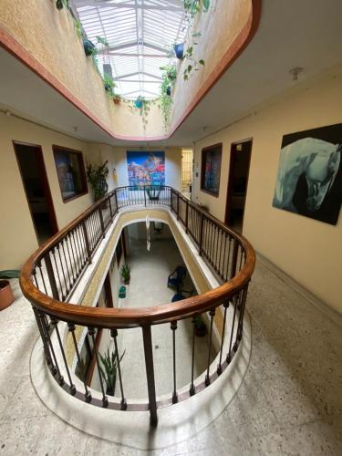 a spiral staircase in a building with a skylight at Hotel Don Jacobo in Palmira