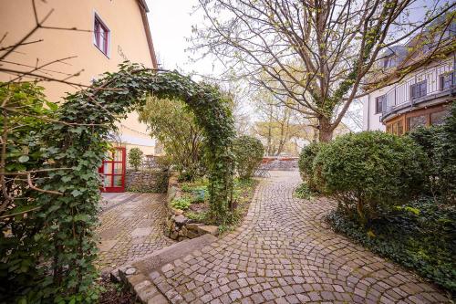 a brick walkway in front of a building at Brauereigasthof-Jakob in Nittenau