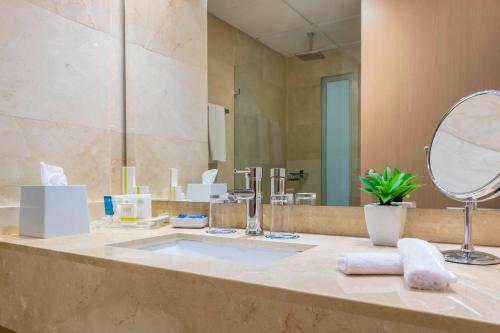 a bathroom with a sink and a mirror at Four Points by Sheraton Barranquilla in Barranquilla