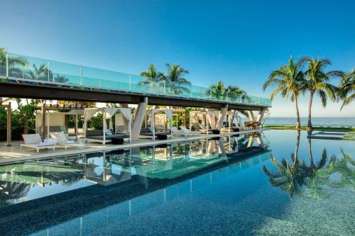 an image of a house with a bridge over a pool at W Punta de Mita in Punta Mita