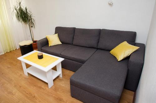 a living room with a couch and a table at Apartment Jase in Split