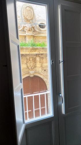 an open door with a view of a building at Principe di Bigottia in Trapani