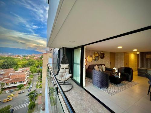 a balcony with a view of a city at Luxury Suites Gema by Cadissa in Medellín