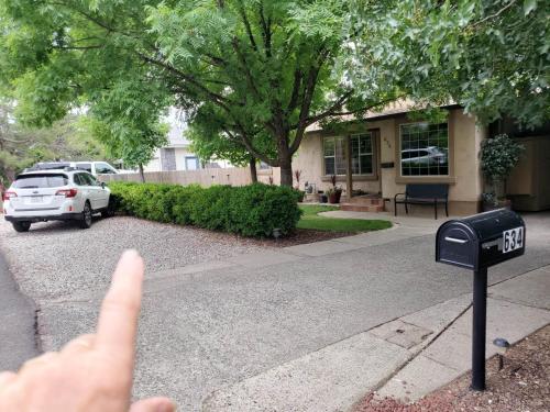 a person pointing at a parking meter in a house at The God Spa in Redding
