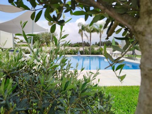 a view of a swimming pool in a resort at Suite12 in Marsala