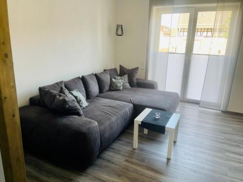 a living room with a couch and a coffee table at Apartment Lindenstein in Fritzlar