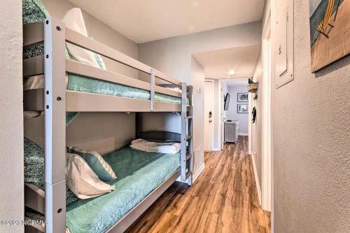 a room with two bunk beds in a room at Ocean View & Easy Beach Access! in Surf City