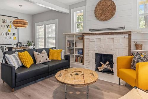 a living room with a couch and a fireplace at BeeKeeper's Inn in Tampa