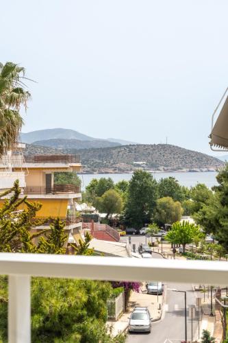 a view of a city from a balcony at Sea View Stylish Penthouse in Varkiza in Vari