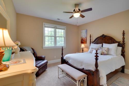 a bedroom with a large bed and a couch at Luxury Estate Private Hot Tub and Pickleball Court in Wake Forest