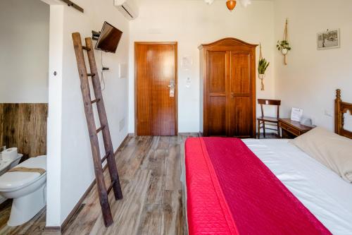 Postel nebo postele na pokoji v ubytování Maremmano BnB