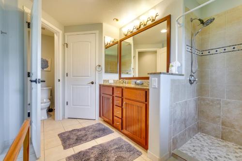a bathroom with a shower and a sink and a toilet at Luxe Maunalani Resort Condo with Pool and Beach Access in Waikoloa