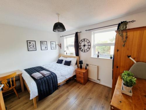 a bedroom with a bed and a window at Underwood at Shoreditch in London