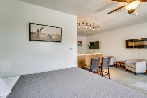 a bedroom with a bed and a living room at Central Lava Hot Springs Studio with Deck and Views! in Lava Hot Springs