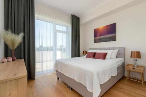 Postel nebo postele na pokoji v ubytování Lehe Apartments in Tartu by EasyRentals