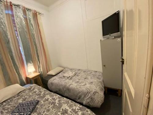Cama o camas de una habitación en Lisbon Bangla