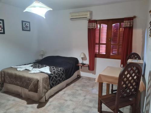 Postel nebo postele na pokoji v ubytování Cabanas Las Pencas, HOSTERIA