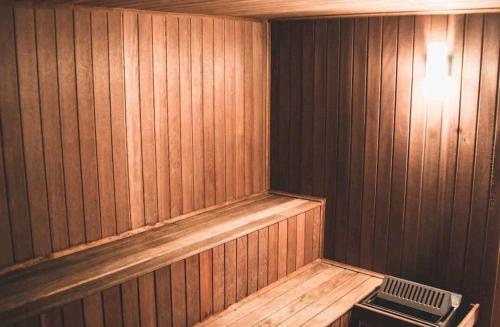 a empty wooden sauna with a fan in it at Arraial do Cabo, Vista mar, conforto, Piscina. in Arraial do Cabo