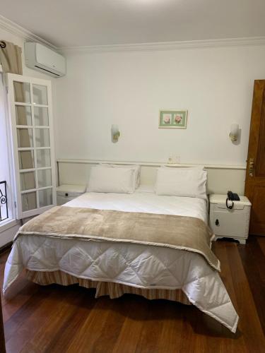 Ένα ή περισσότερα κρεβάτια σε δωμάτιο στο Hotel e Spa Provençal