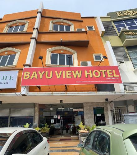 a hotel with cars parked in front of it at Bayu View Hotel Klang in Klang