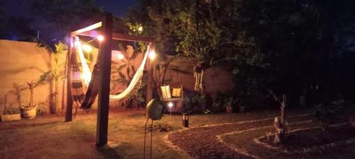 a house with lights in a yard at night at Posada de Sofi in Concordia