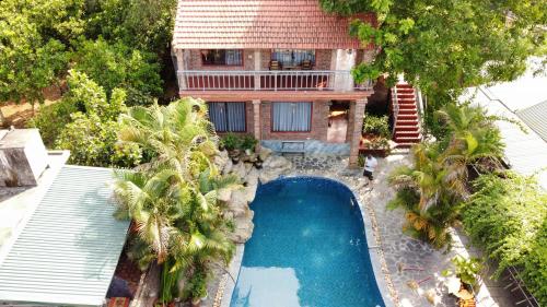 an aerial view of a house with a swimming pool at Ninh Binh Mountain View Homestay & Restaurant in Ninh Binh
