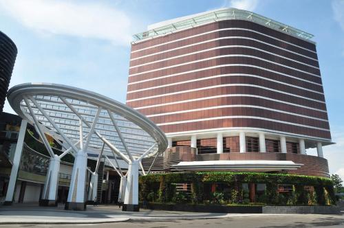 a tall building with a spiral staircase in front of it at The Trans Luxury Hotel Bandung in Bandung
